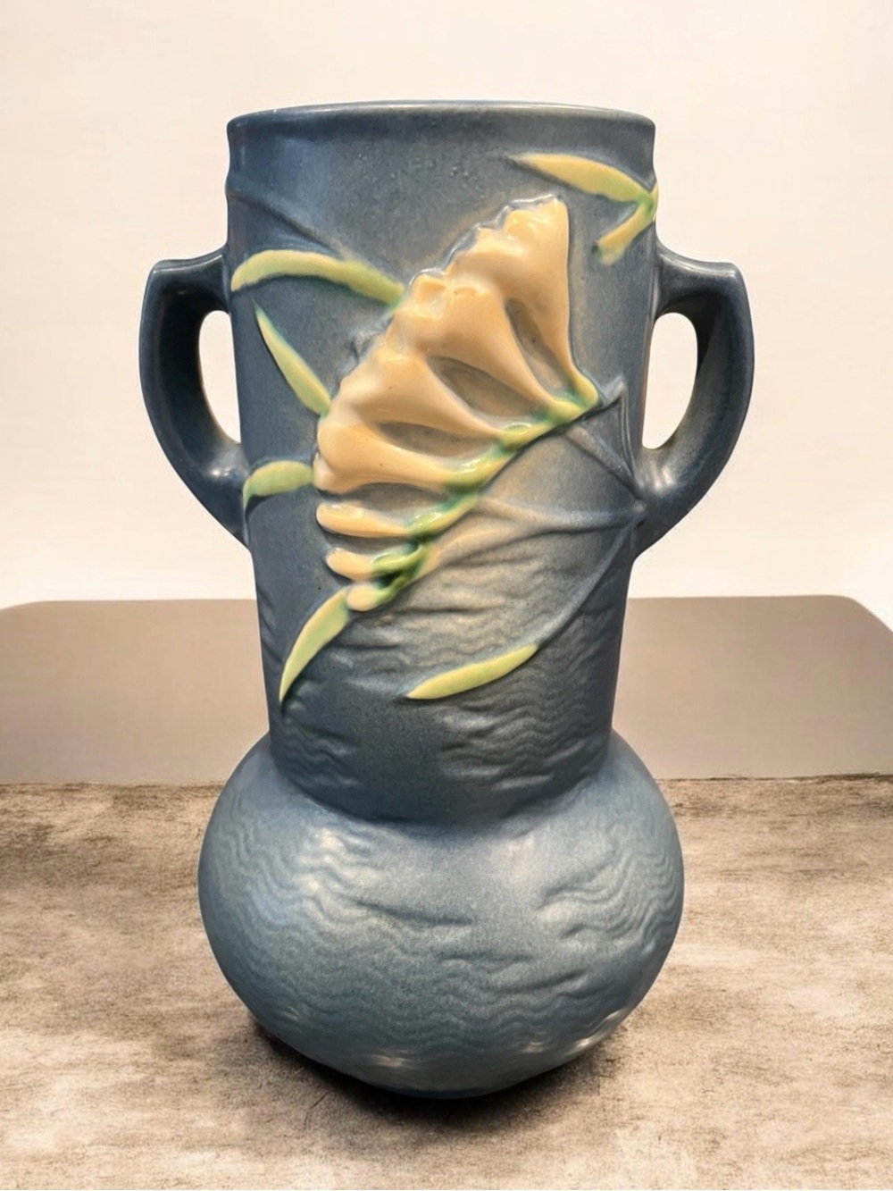 Vintage 1940 Large Roseville Pottery blue Freesia vase with two handles.